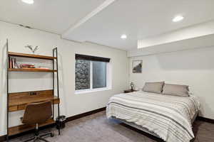 Bedroom with recessed lighting and a desk