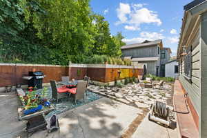 View of patio / terrace featuring outdoor dining area and a grill