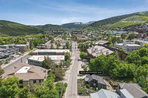 Aerial perspective of suburban area with a mountainous background