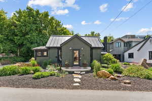 View of front of home featuring a standing seam roof and a metal roof