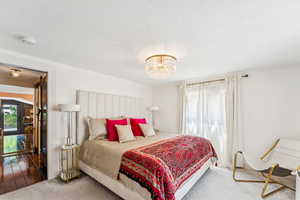 Bedroom featuring a chandelier