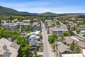 Aerial perspective of suburban area featuring a mountainous background