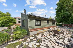 Back of property with a patio and a chimney