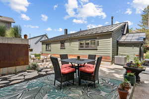 View of patio with outdoor dining space