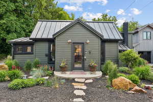 View of front of home featuring a standing seam roof and a metal roof