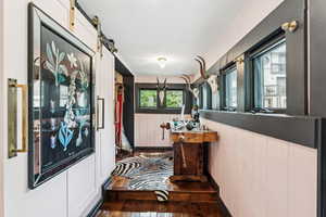 Corridor featuring hardwood / wood-style floors and a barn door