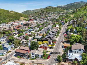 Aerial perspective of suburban area featuring a mountain backdrop