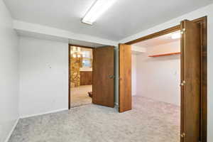 Spare room with carpet floors and a textured ceiling