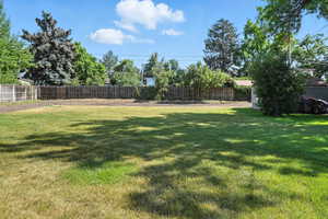View of fenced backyard