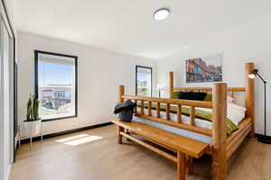 Master bedroom with LVP flooring and king bed