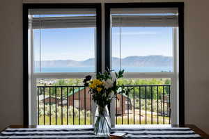 Water view featuring a mountainous background from dining table