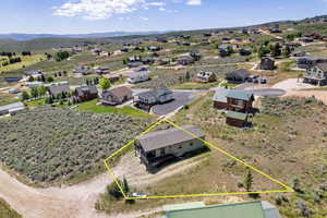 Aerial perspective of suburban area featuring property boundaries highlighted