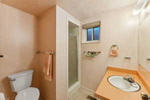 Bathroom with a tile shower and vanity