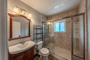 Bathroom with vanity and a stall shower