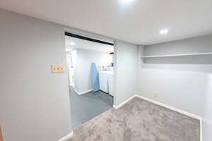 Finished basement with washer and dryer, carpet flooring, and recessed lighting