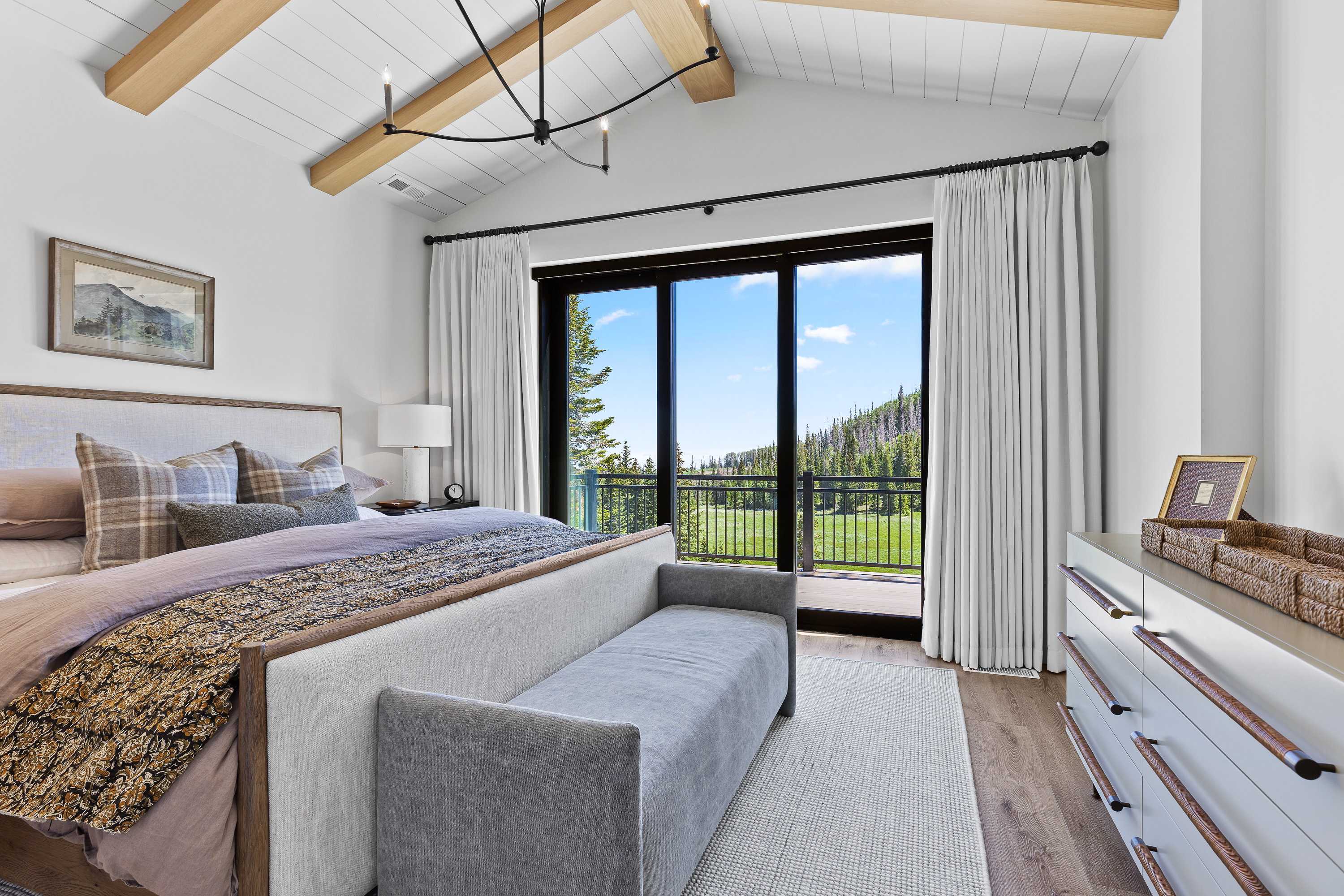 Bedroom featuring light wood finished floors, access to exterior, and wooden ceiling