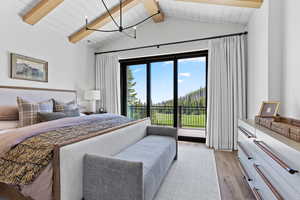 Bedroom featuring light wood finished floors, access to exterior, and wooden ceiling