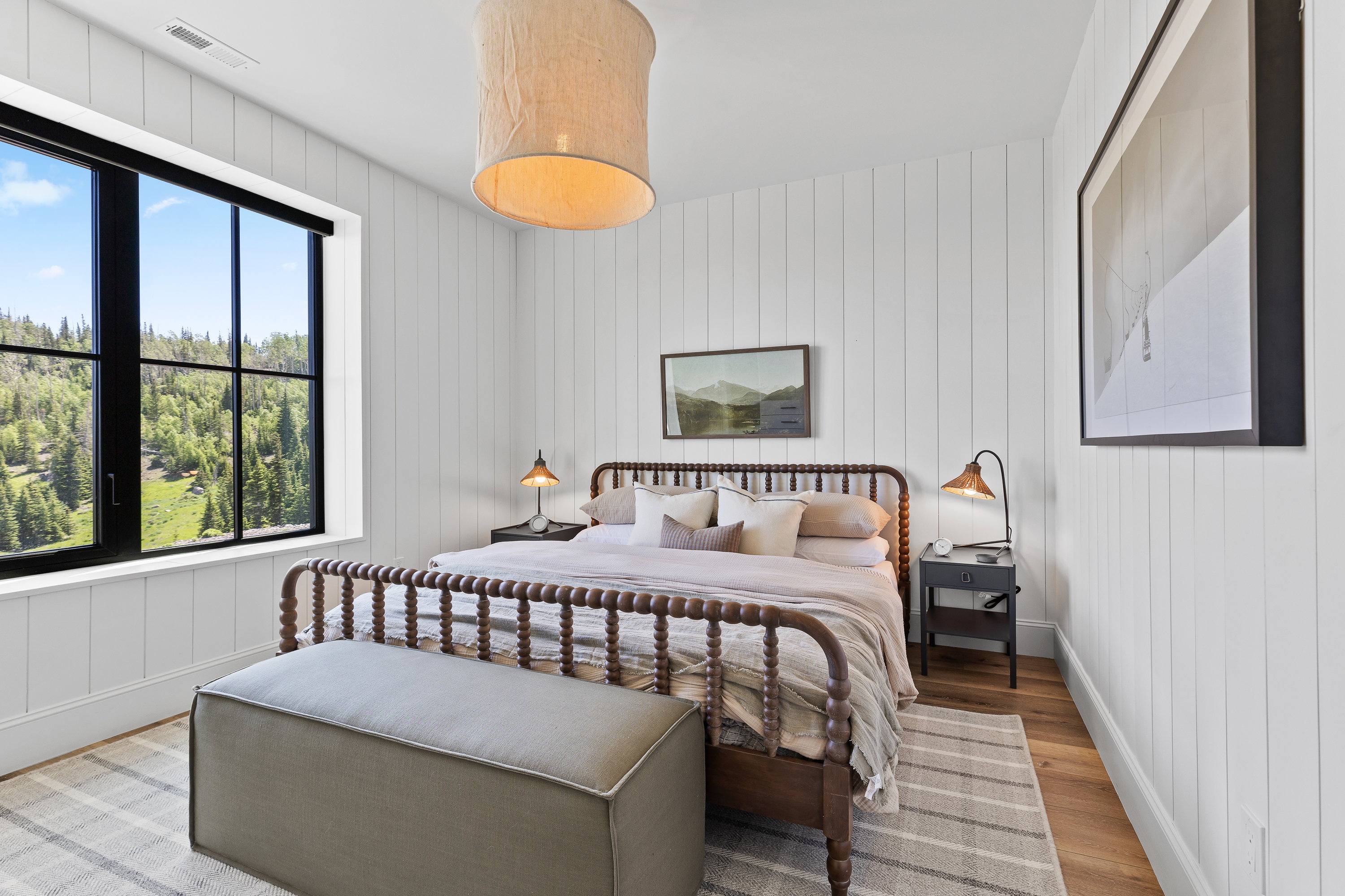 Bedroom featuring light wood-style flooring and multiple windows
