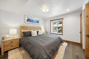 Bedroom featuring wood finished floors and recessed lighting