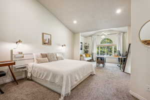 Bedroom featuring carpet flooring, lofted ceiling, and recessed lighting