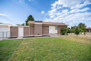 Back of property featuring brick siding