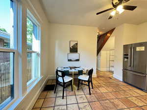 Dining room featuring baseboards and a ceiling fan