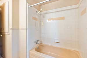 Full bath featuring shower / washtub combination