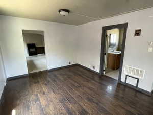 Spare room featuring hardwood / wood-style flooring