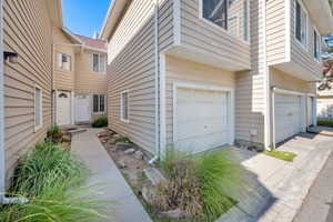 View of home with an attached garage and driveway