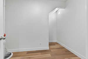 Unfurnished room with baseboards and light wood finished floors