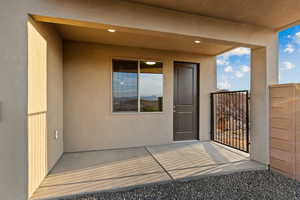 Doorway to property with stucco siding
