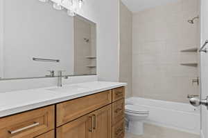 Full bathroom with vanity, tub / shower combination, and tile patterned floors