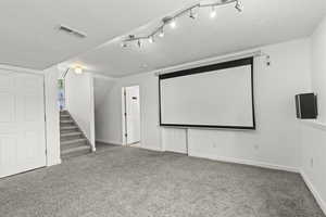 Carpeted cinema with baseboards