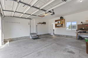 Garage featuring a garage door opener