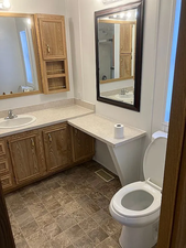 Bathroom with vanity and toilet