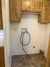 Laundry room featuring cabinet space and hookup for a washing machine