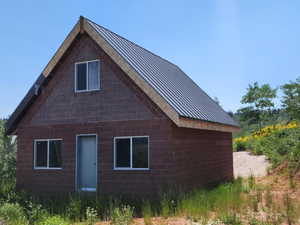 View of home's exterior with a metal roof and a standing seam roof