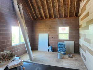 Miscellaneous room with vaulted ceiling