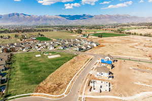 Aerial perspective of suburban area with a mountain backdrop