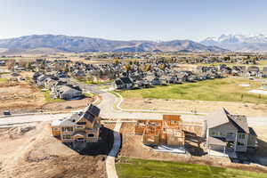 Aerial perspective of suburban area featuring a mountainous background