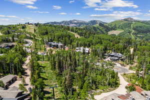 Bird's eye view of mountains and a heavily wooded area