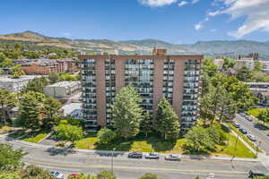 View of apartment building / complex featuring a mountain view