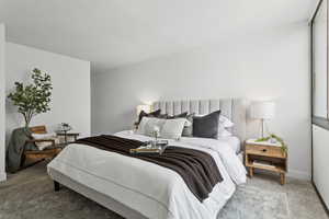 Carpeted bedroom with baseboards