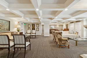 Lounge featuring carpet flooring, coffered ceiling, beamed ceiling, and crown molding