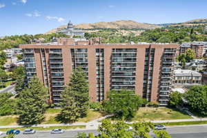 View of apartment building / complex featuring a mountain view