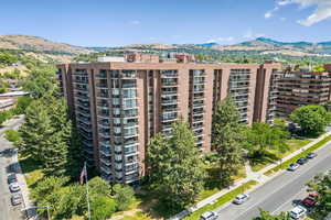 View of apartment building / complex featuring a mountain view