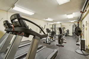 Exercise room with a textured ceiling