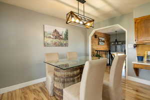 Dining room featuring a chandelier and light wood-type flooring