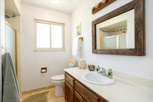 Bathroom with vanity and a shower stall