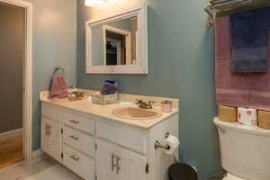 Bathroom with toilet and double vanity